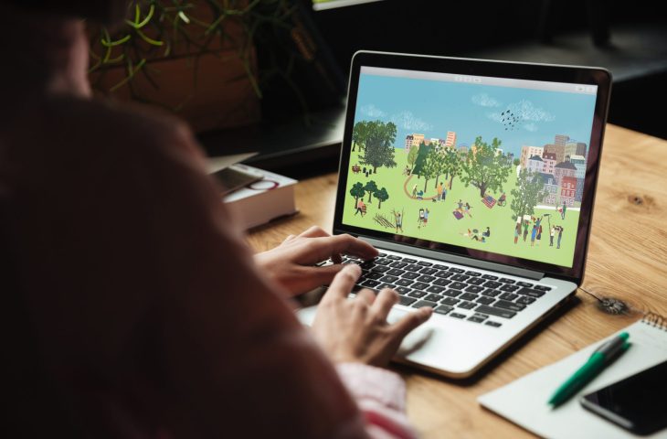 Soneone using a PC at a table accessing the new trees outside of woodlands interactive PDF resource