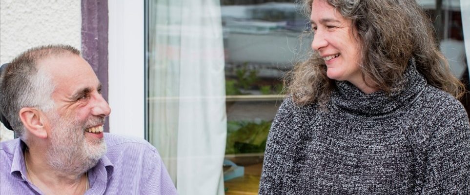 Photo of Tom Jenkins with his wife and dog.